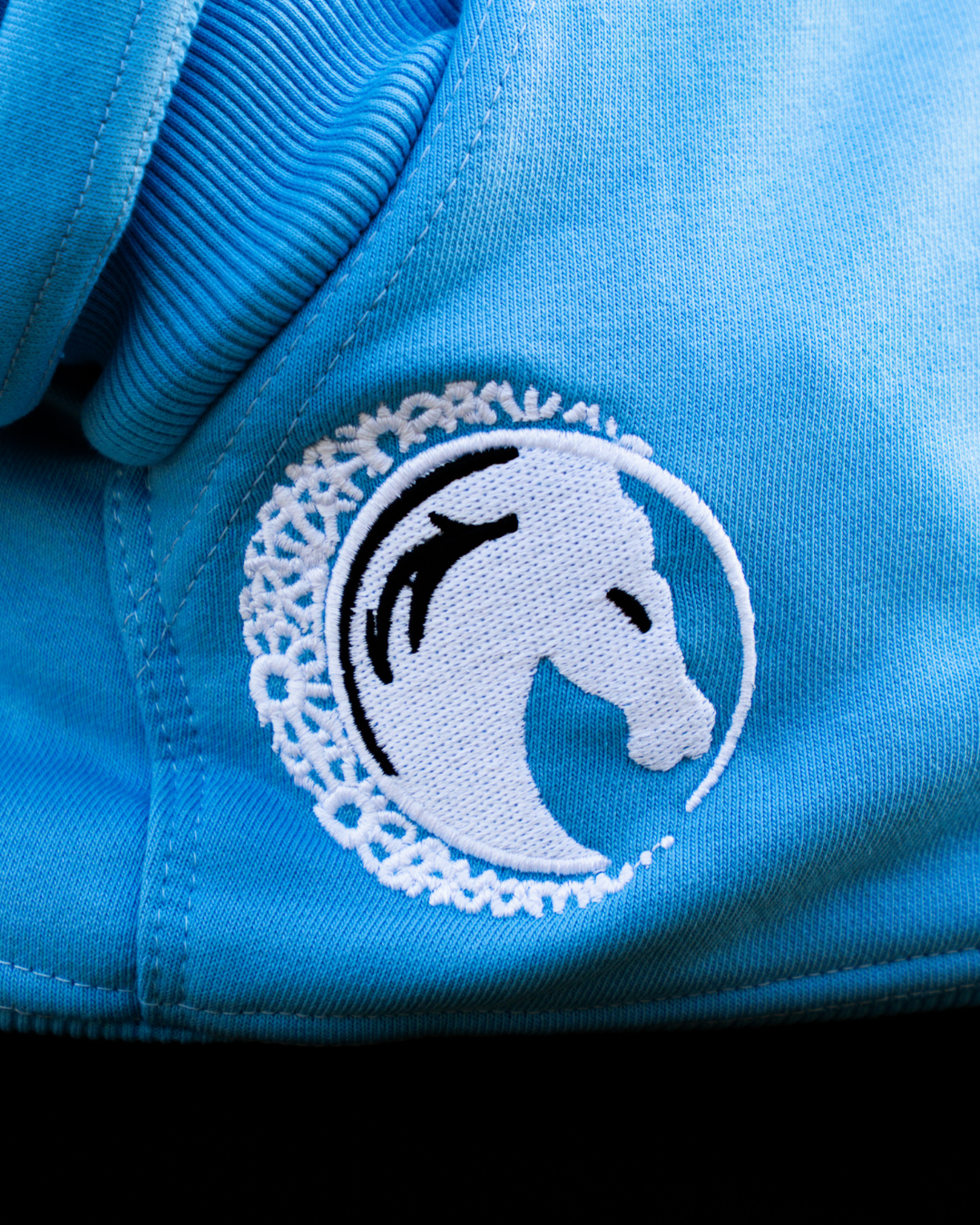 Model wearing the powder blue Khair Ummah zip hoodie.